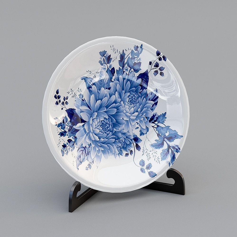 White ceramic plate with blue floral pattern on black stand on grey background