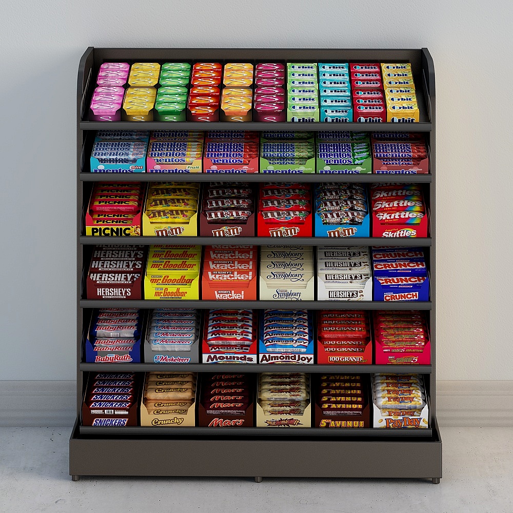 Dark grey metal candy display shelf with colorful snacks on white background