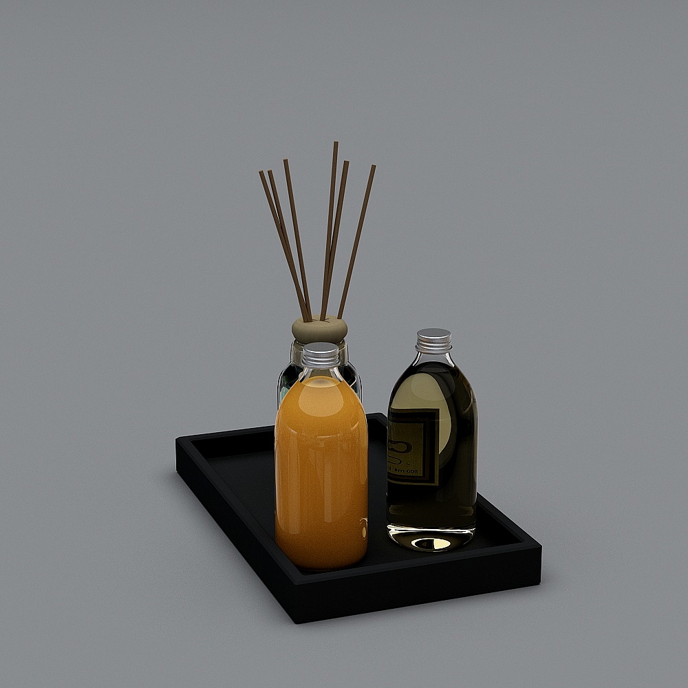 Black tray with orange liquid bottle and dark glass reed diffuser on grey background