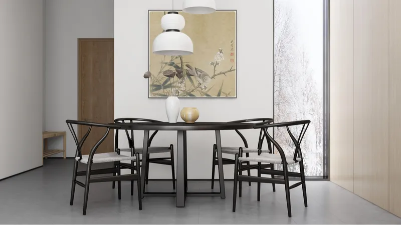 Dining room with black round table wooden chairs white ceiling lights and bird wall painting