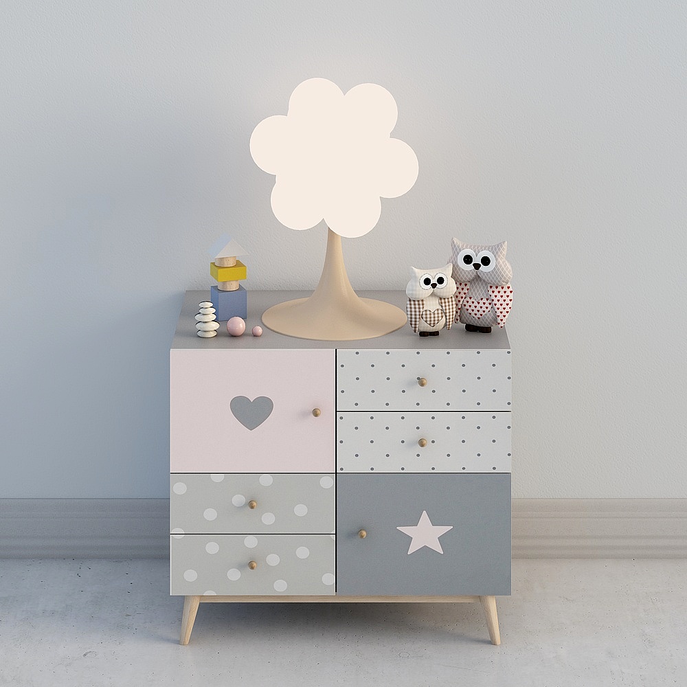 Children's chest of drawers with pink grey polka dot heart star patterns and cloud lamp on white background