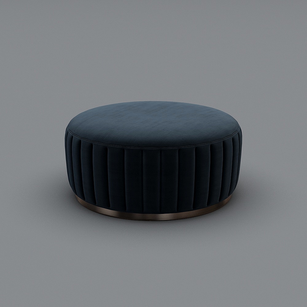 Round dark blue velvet footrest with vertical stitching and brass base on grey background