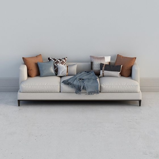 Modern beige fabric sofa with brown pillows and blue blanket on grey background