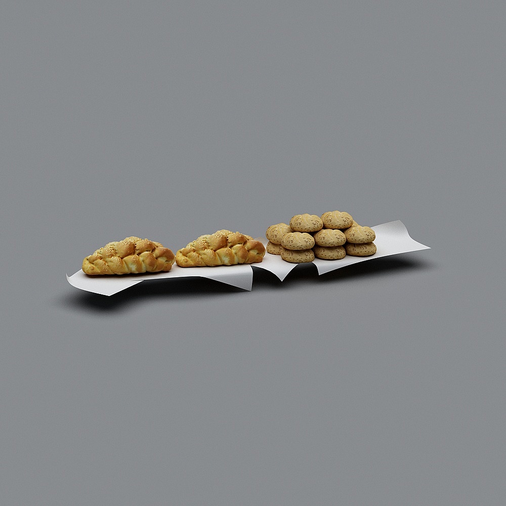 Golden braided bread and cookies on white paper on grey background