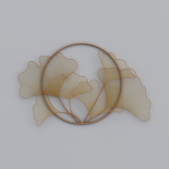 Gold metal wall art with leaf shapes in round frame on grey background