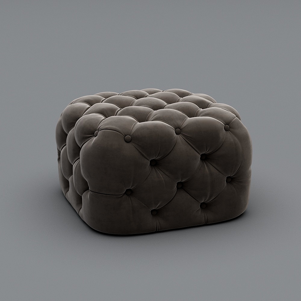 Modern dark grey tufted velvet footrest with soft rounded shape on grey background