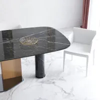 Black marble table with gold bowl, white chairs, marble floor, and a long pink curtain