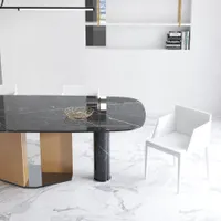 Modern black marble dining table with wooden legs white chairs and white marble tile floor