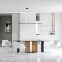 Minimalist dining area with black marble table, white chairs, marble floor, and hanging ceiling light