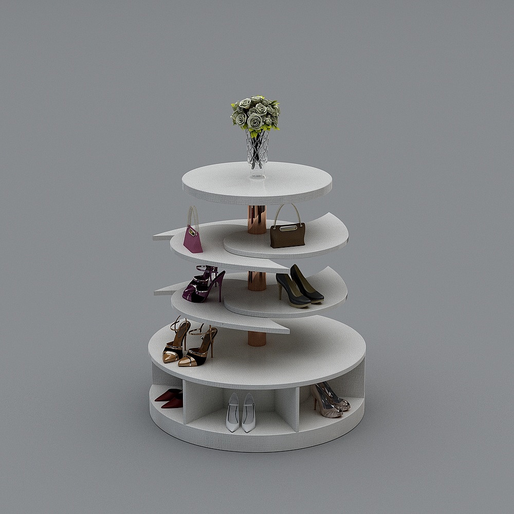 White round tiered display stand with copper center pole holding shoes and bags on grey background