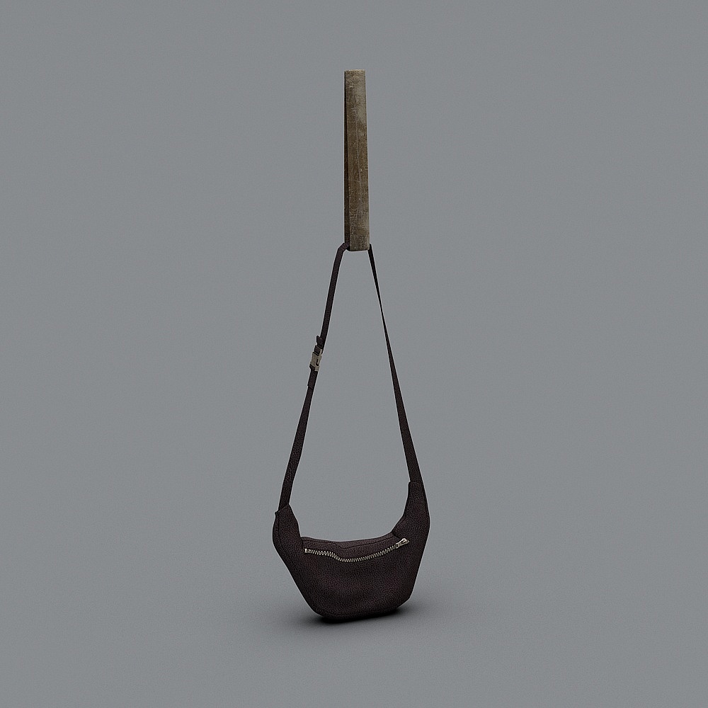 Dark brown leather shoulder bag with silver zipper hanging on grey background