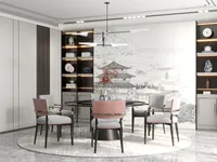 Dining area featuring a round table pink chairs black cabinet and mountain scenery wall mural