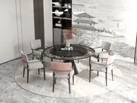 Round black marble dining table with grey and pink chairs on a light round carpet
