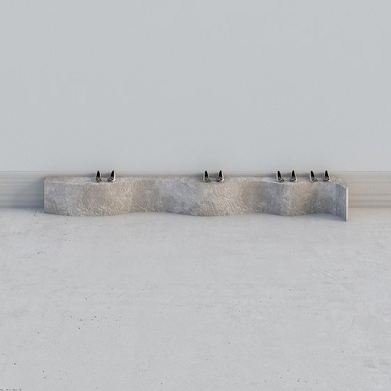Modern wavy stone bench with textured beige surface and metal legs on grey background