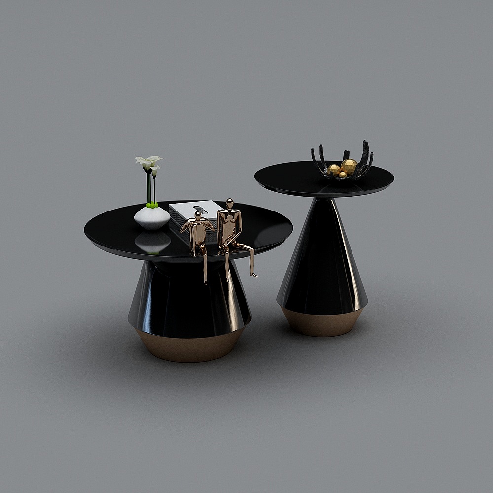 Modern black round side tables with gold bases and decorative items on grey background