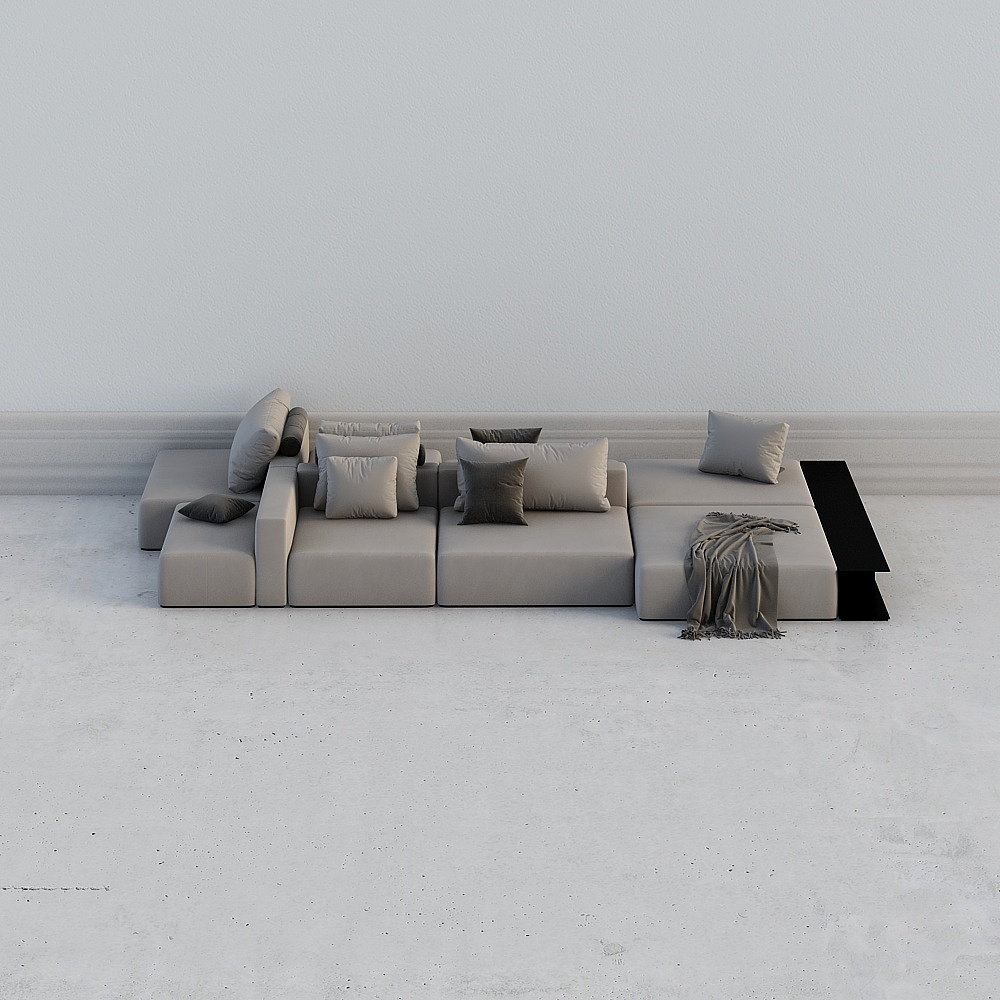 Modern light grey fabric sectional sofa with pillows and black side table on white background