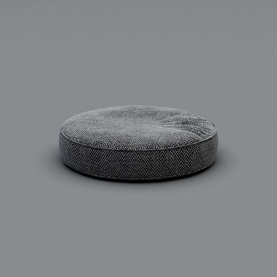 Modern round dark grey fabric floor cushion with textured weave pattern on grey background