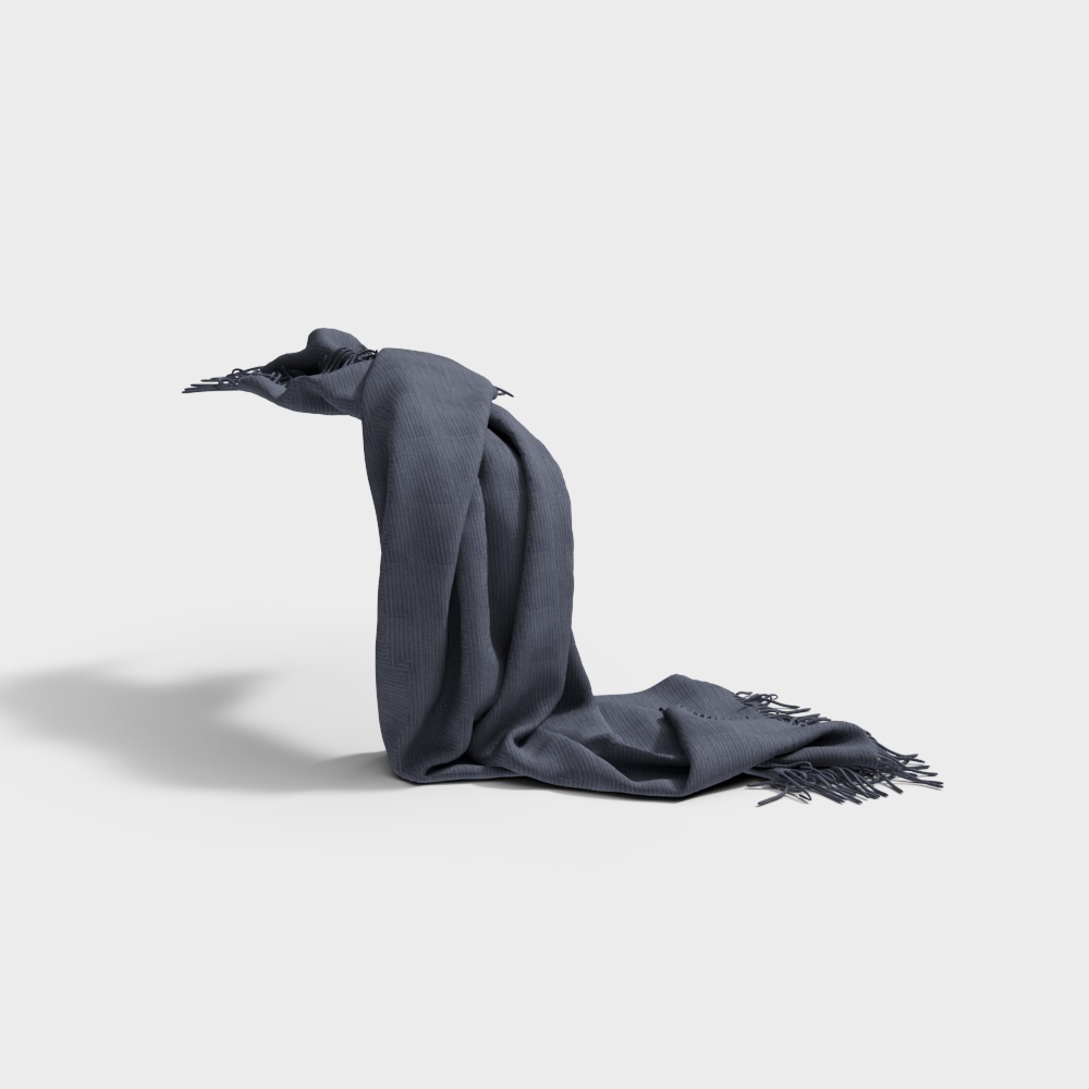 Dark grey knitted throw blanket with tassels draped on white background
