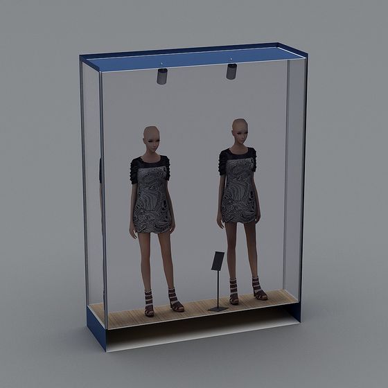 Modern blue glass display case with two mannequins wearing dresses on grey background