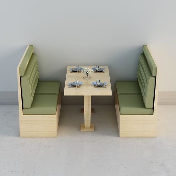 Dining booth with light wood table and green tufted benches on grey background