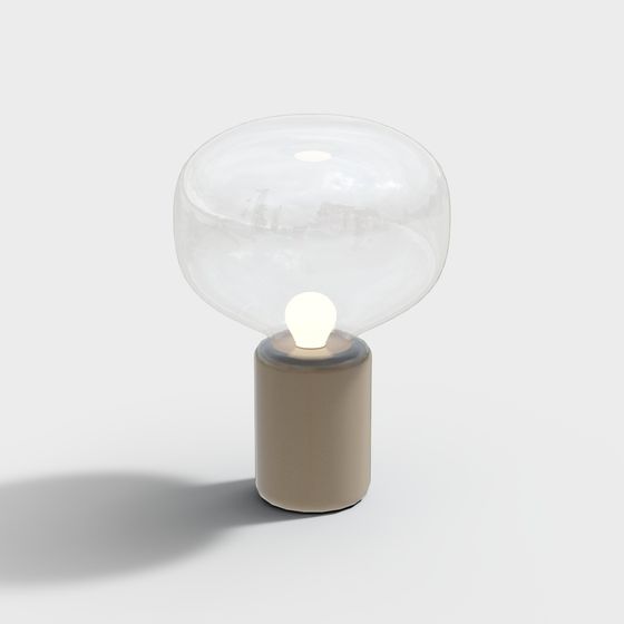 Modern table lamp with clear glass shade and beige ceramic base on white background