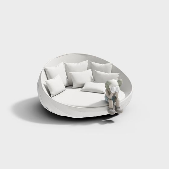 Modern white round bed with six pillows and small toy figure on grey background