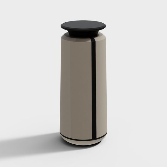 Modern beige cylindrical side table with black top and vertical stripe on white background