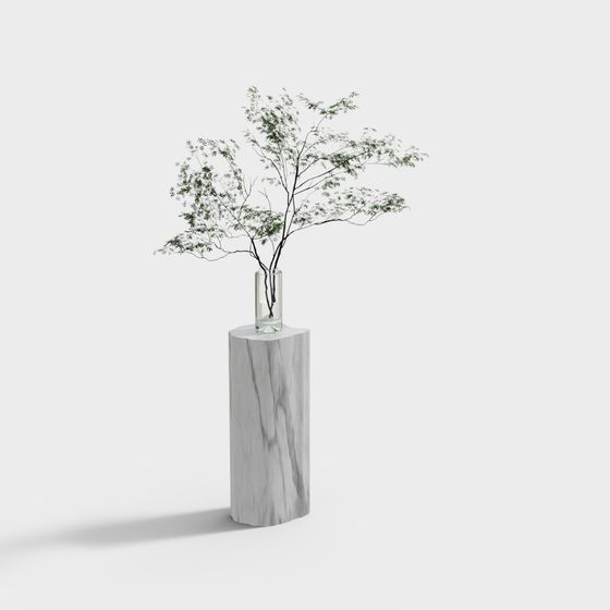 Tall white marble display stand with clear glass vase holding green tree branches on white background