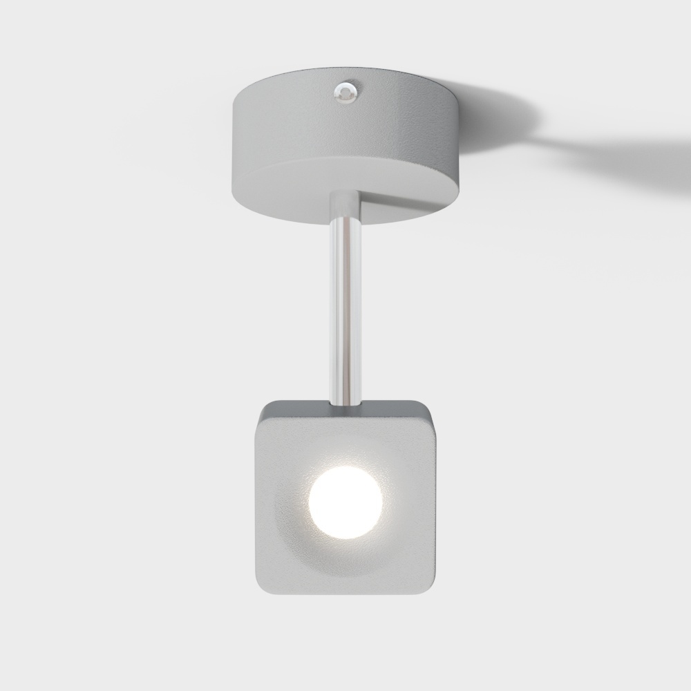 Modern white ceiling light with square head and silver rod on grey background