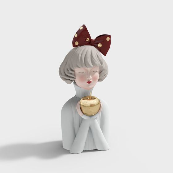 Girl figurine with red bow holding golden apple on white background