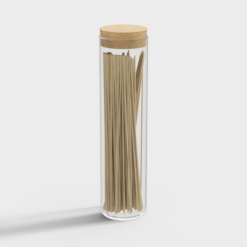 Clear glass jar with cork lid holding wooden sticks on white background