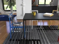 Modern dining room with black table, blue clear chair, grey rug, yellow mug, and books