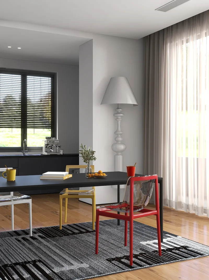 Modern dining area with black table colorful chairs patterned rug and large white floor lamp