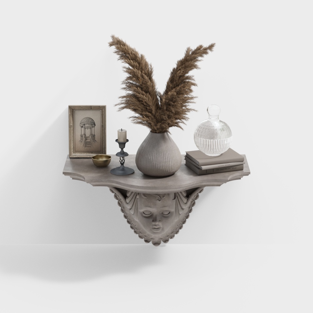 Grey decorative wall shelf with face carving holding vase and books on white background