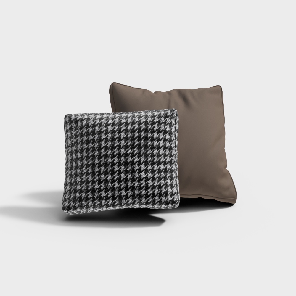 Two square throw pillows one patterned black and white one solid brown on light grey background