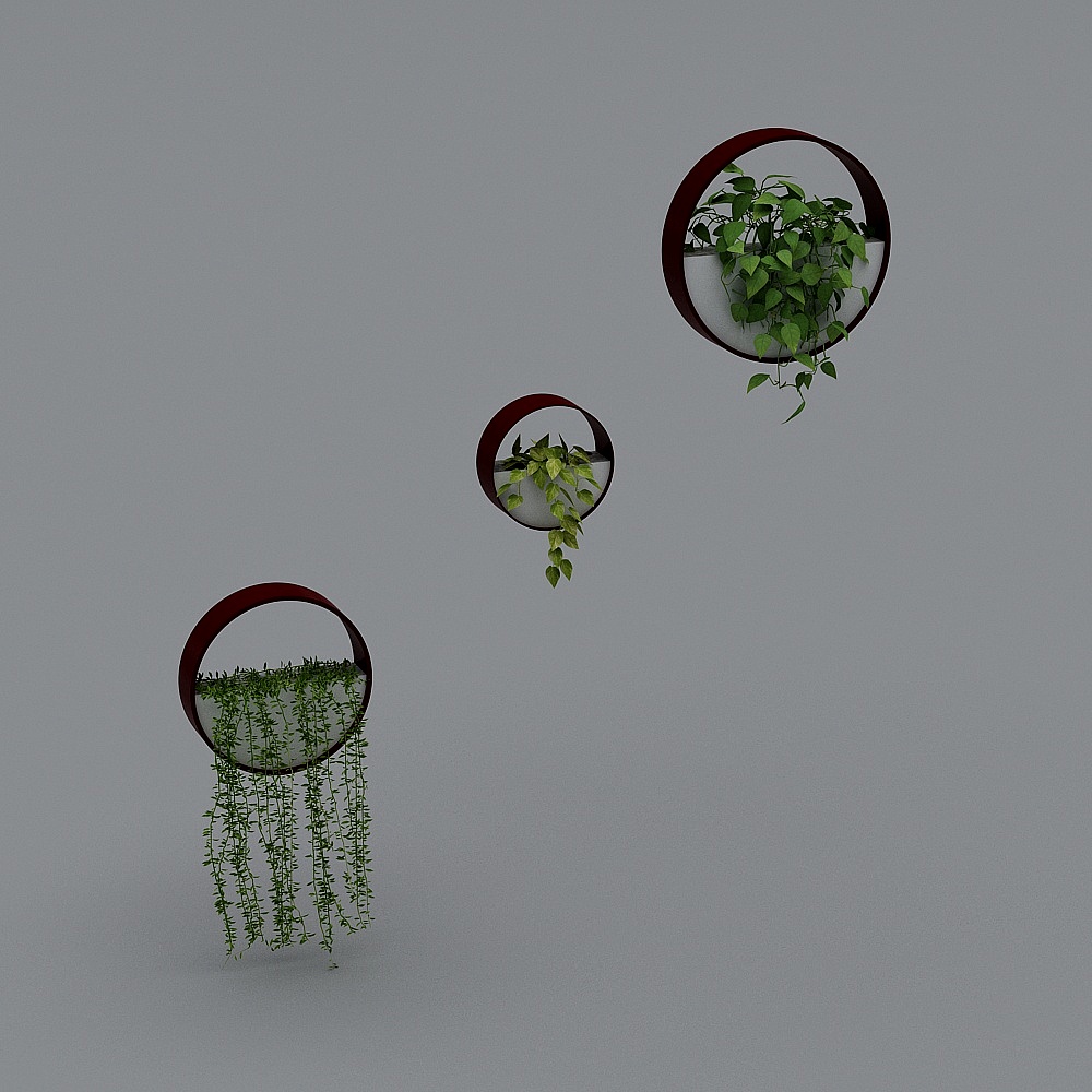 Three round red metal wall planters with green hanging plants on grey background