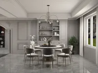 Elegant dining room featuring round marble table, grey chairs, wall panel, and modern ceiling light
