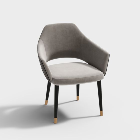 Modern grey fabric armchair with black legs and gold tips on white background