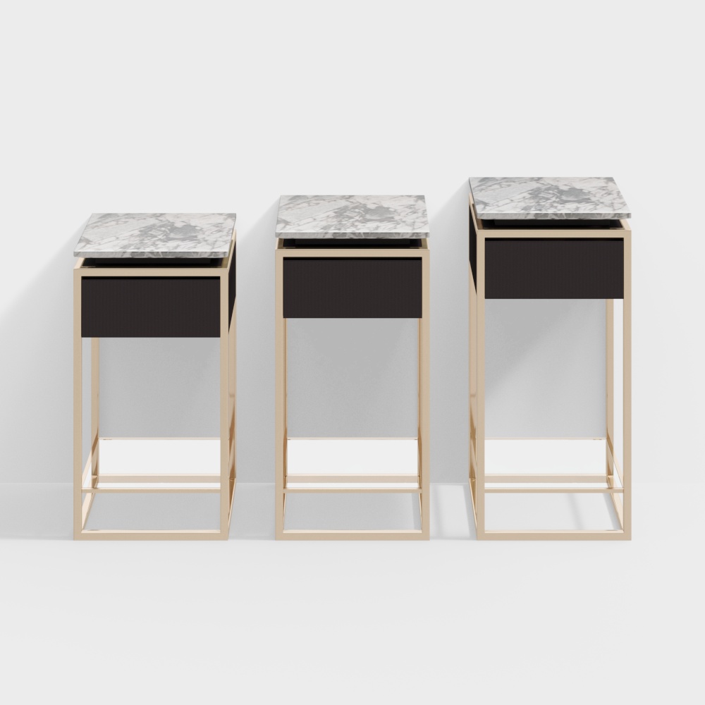 Three modern nesting tables with gold metal frames and marble tops on grey background