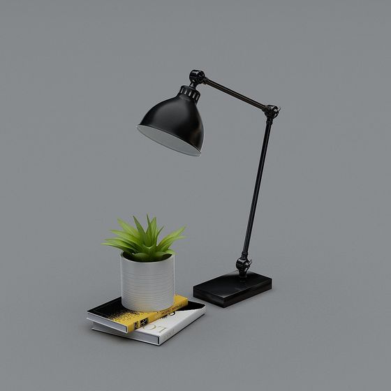 Modern black metal desk lamp with adjustable arm and green plant on grey background