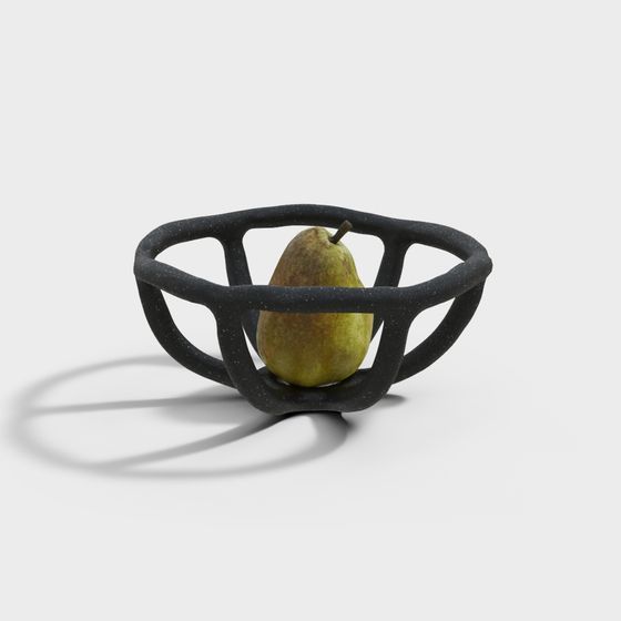 Modern black speckled open fruit bowl holding a green pear on white background