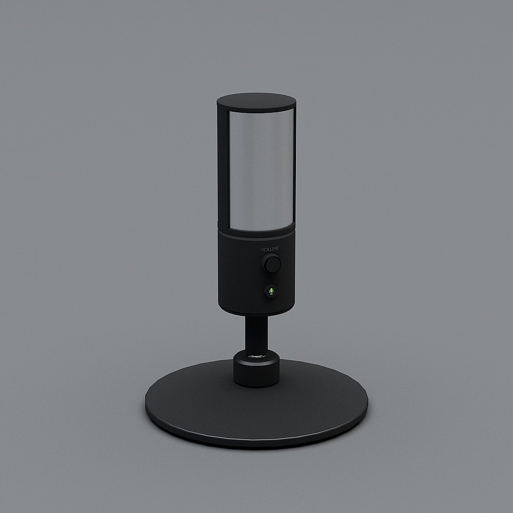 Black table lamp with silver mesh shade and round base on grey background