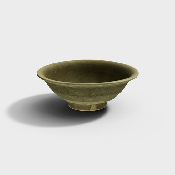 Small green ceramic bowl with wide rim and short foot on white background