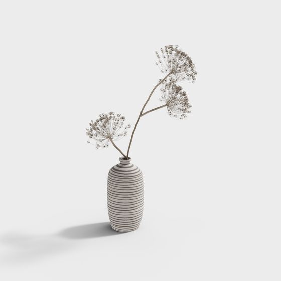 White ceramic vase with horizontal grey stripes holding dried flowers on white background