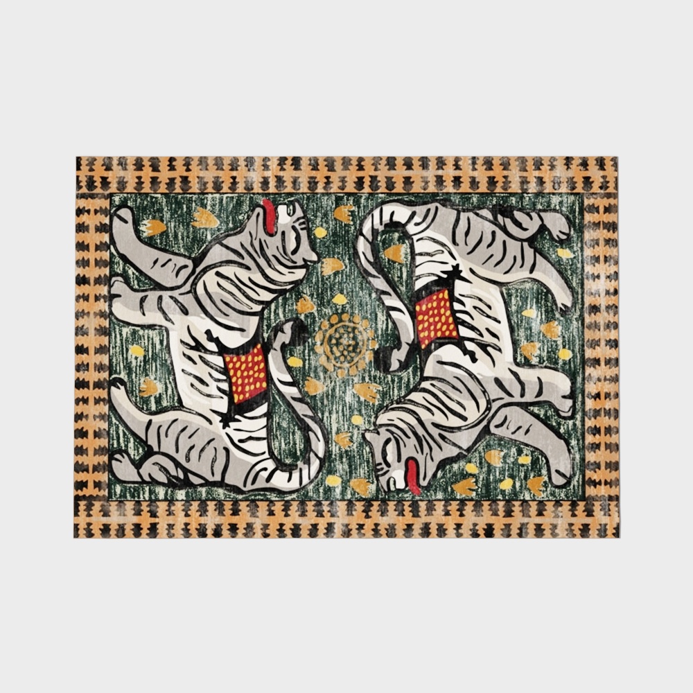 Traditional art rug with two white tigers on green background with orange border on grey background