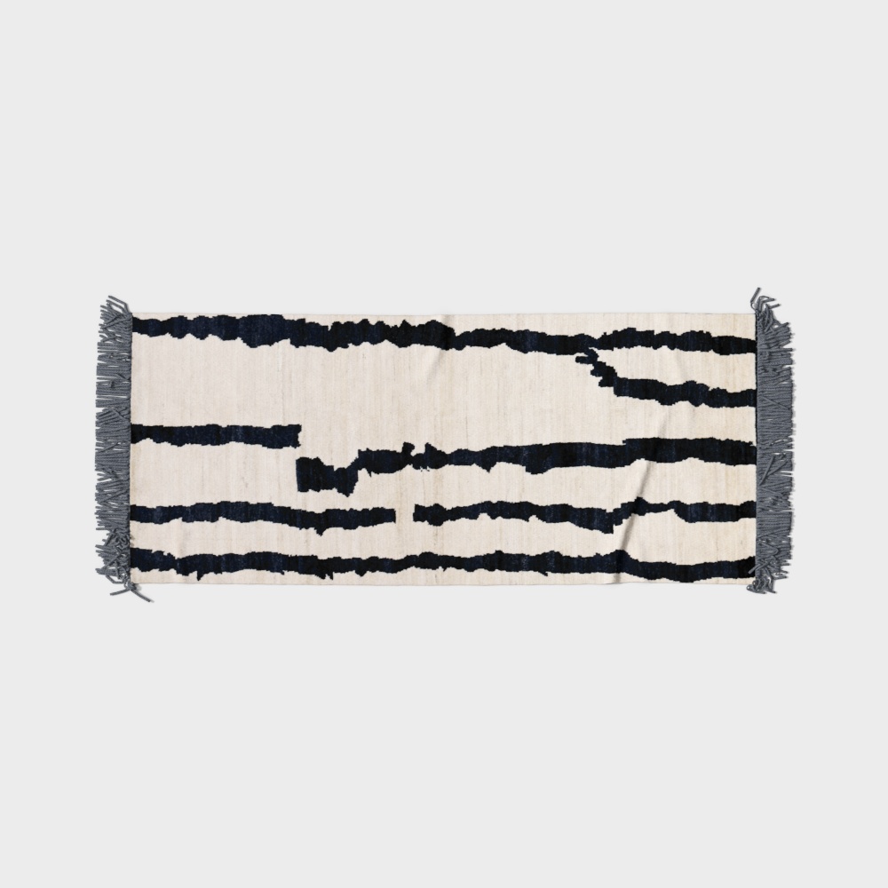Cream cotton rug with dark blue horizontal stripes and grey tassels on light grey background