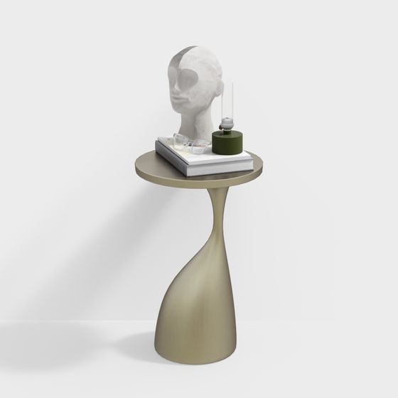 Modern gold metal side table with round top and curved base on white background