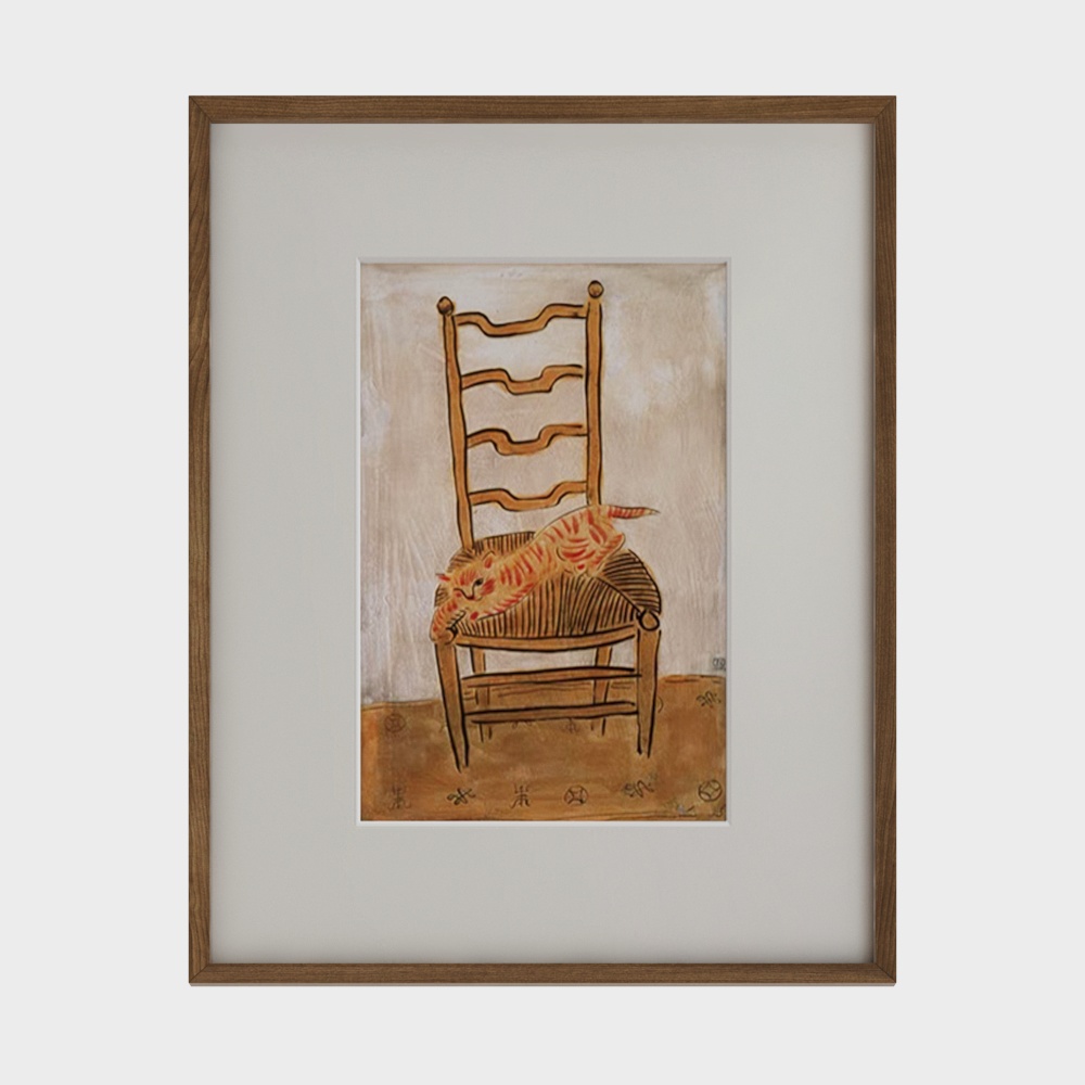 Framed art print of orange cat sleeping on wooden chair on white background