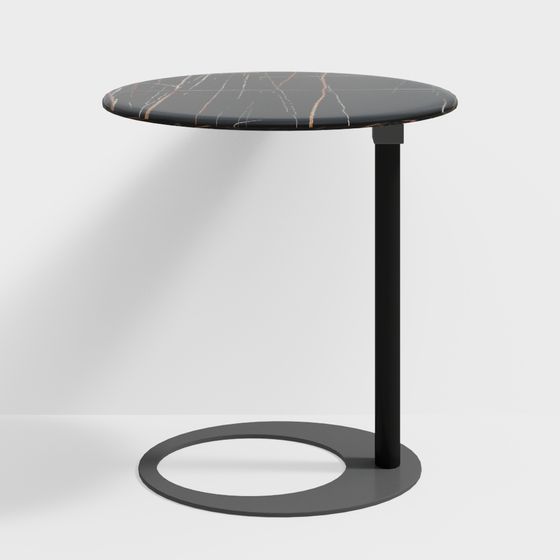 Modern round side table with black marble top and matte metal base on white background