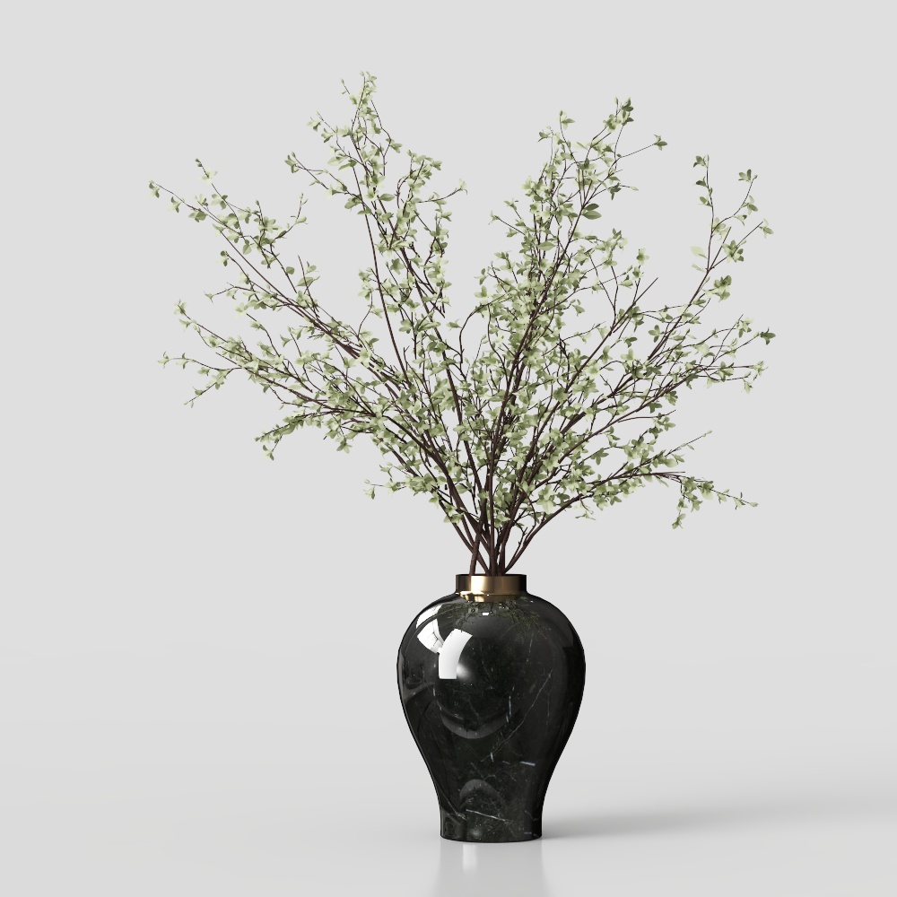 Round black marble vase with gold rim holding green leafy branches on grey background